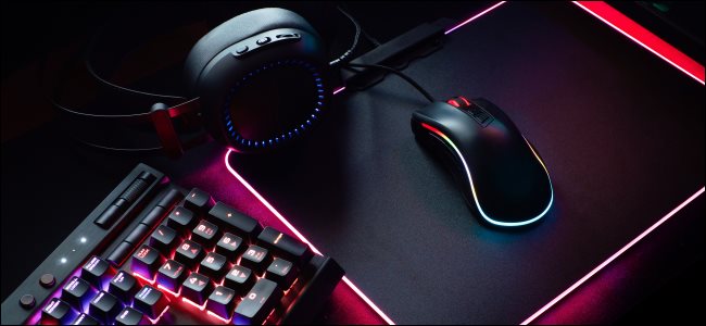 A gaming keyboard, mouse, and headphones.