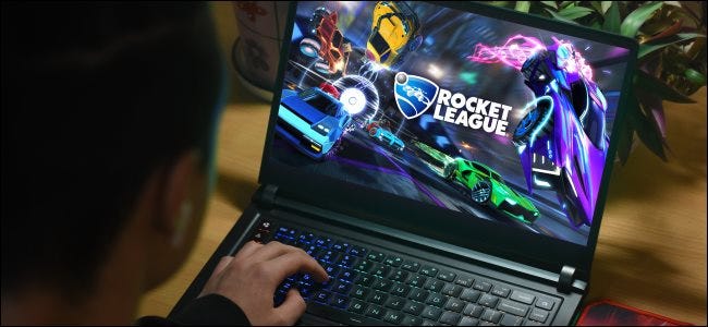 A person playing Rocket League on a PC laptop.