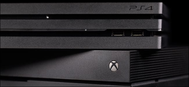 A PlayStation 4 console on top of an Xbox One.
